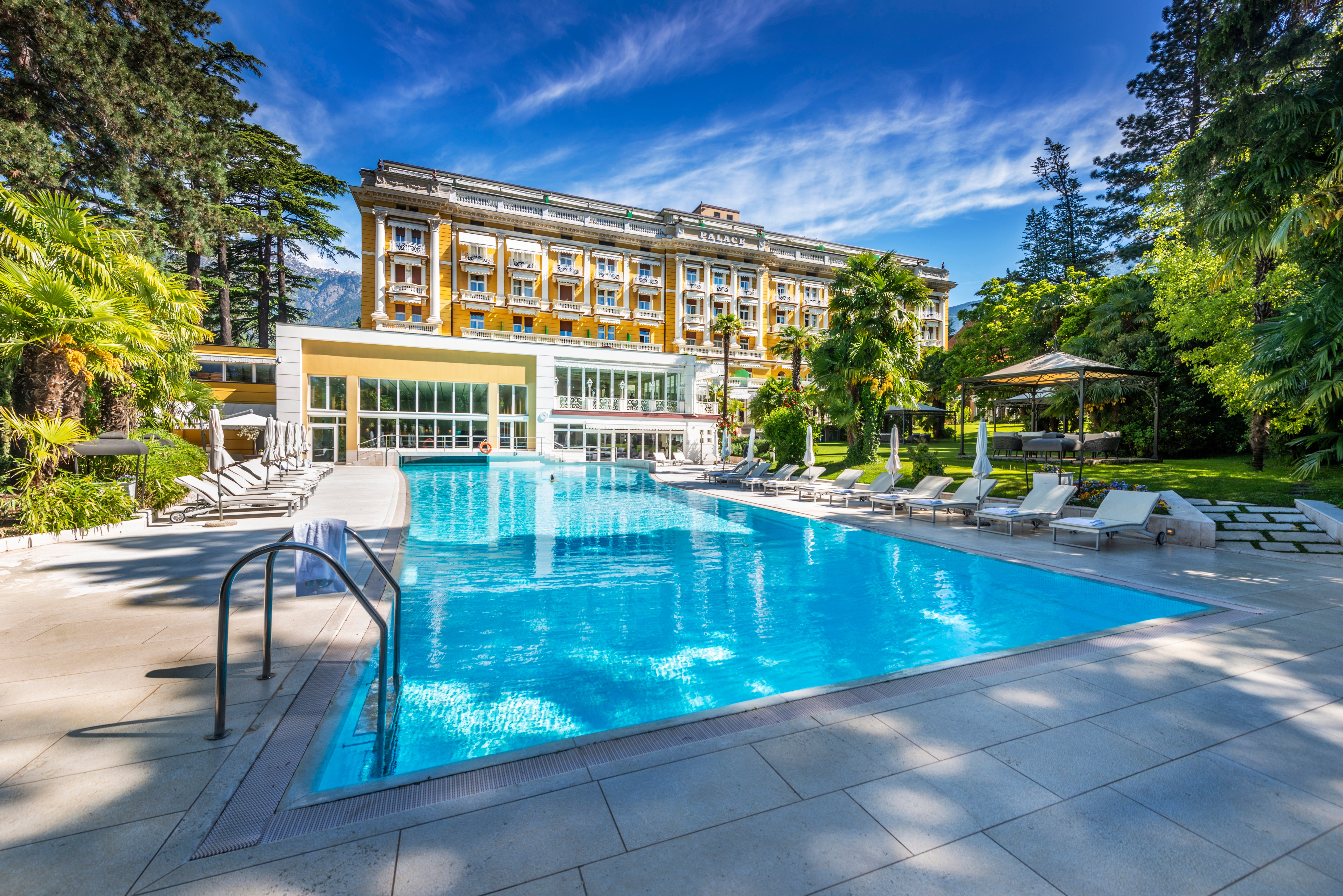 The panoramic dining room overlooks the outdoor pool